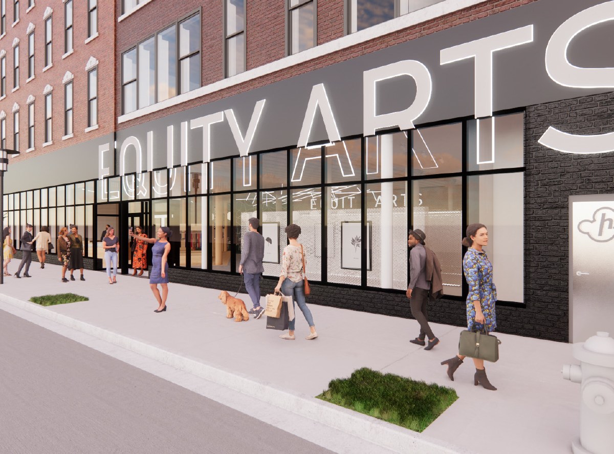 A computer rendering shows the facade of the building, with people walking in front of it. It has glass windows and says Equity Arts across it.