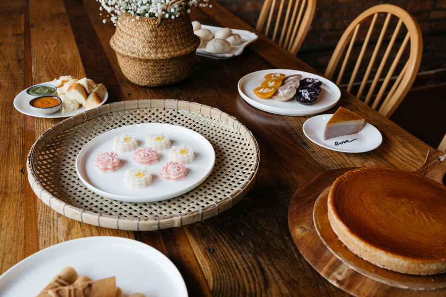 Clockwise, from the center: khanom chan, blossom-shaped steamed cakes; a khanom pang-sangkhaya set; “buddy buns;”  "sibling" cakes; taro chiffon cake; Khanom Tokyo