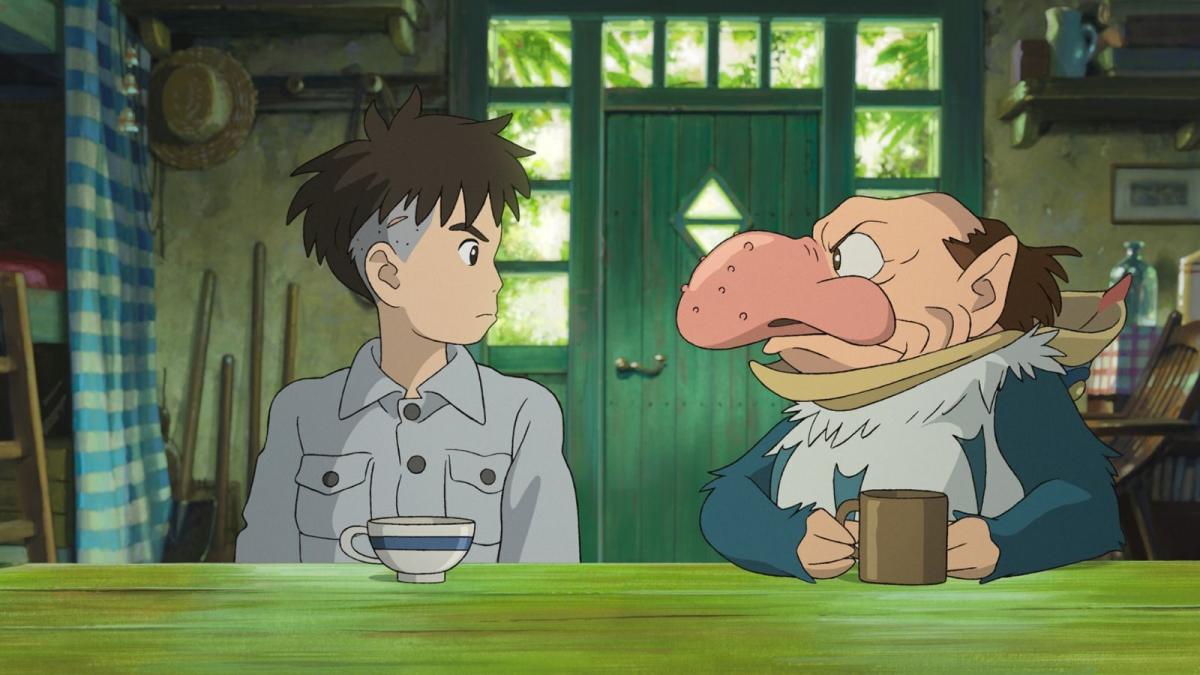 an animated boy sits at a counter with a tea cup, next to a human-like figure with a giant nose